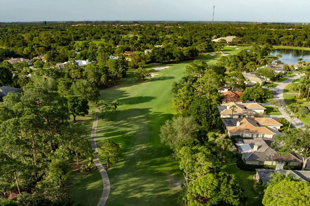 aerial photo of bent pine golf course overlooking fairway and homes